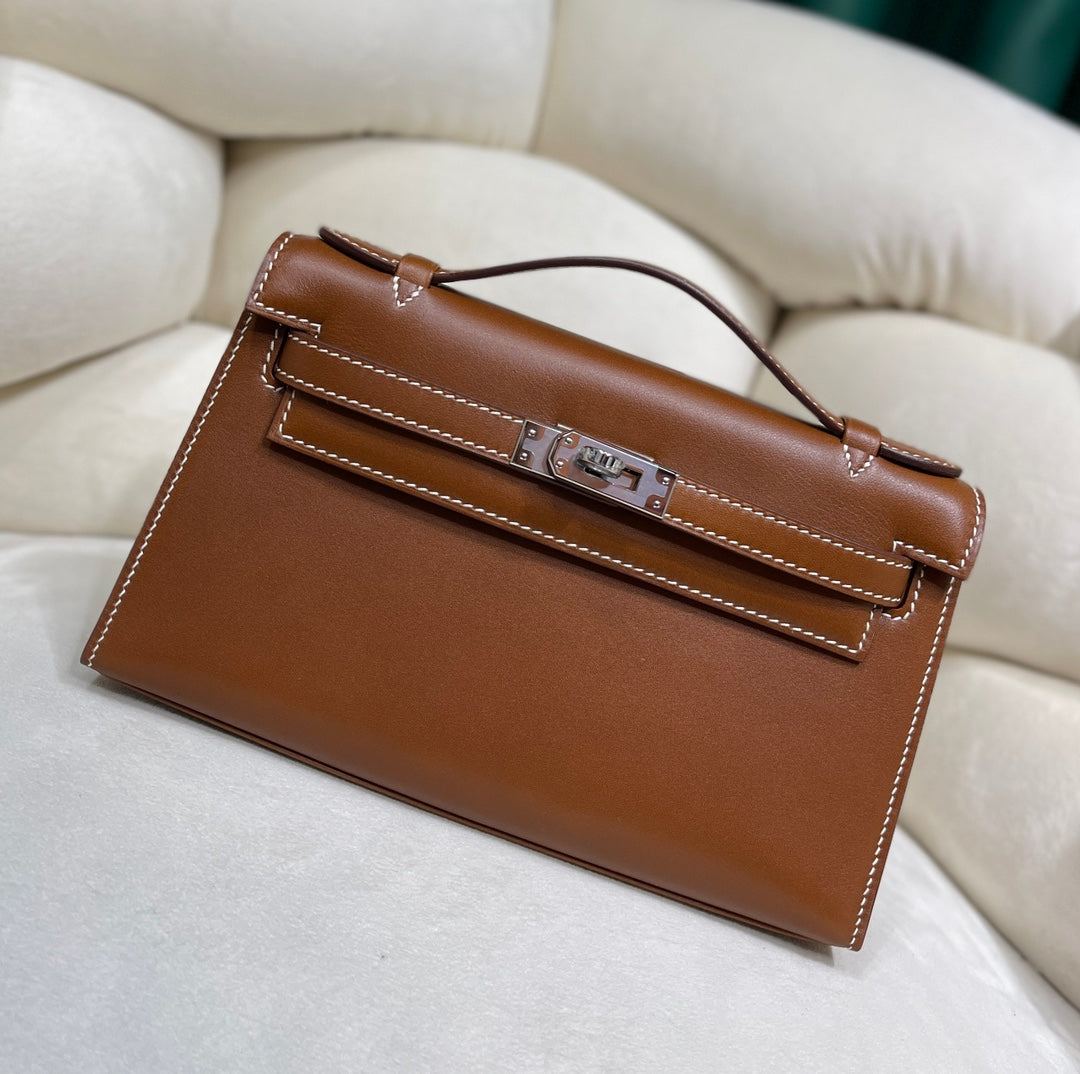 Gold Swift Pochette Handbag with Elegant Gold Hardware