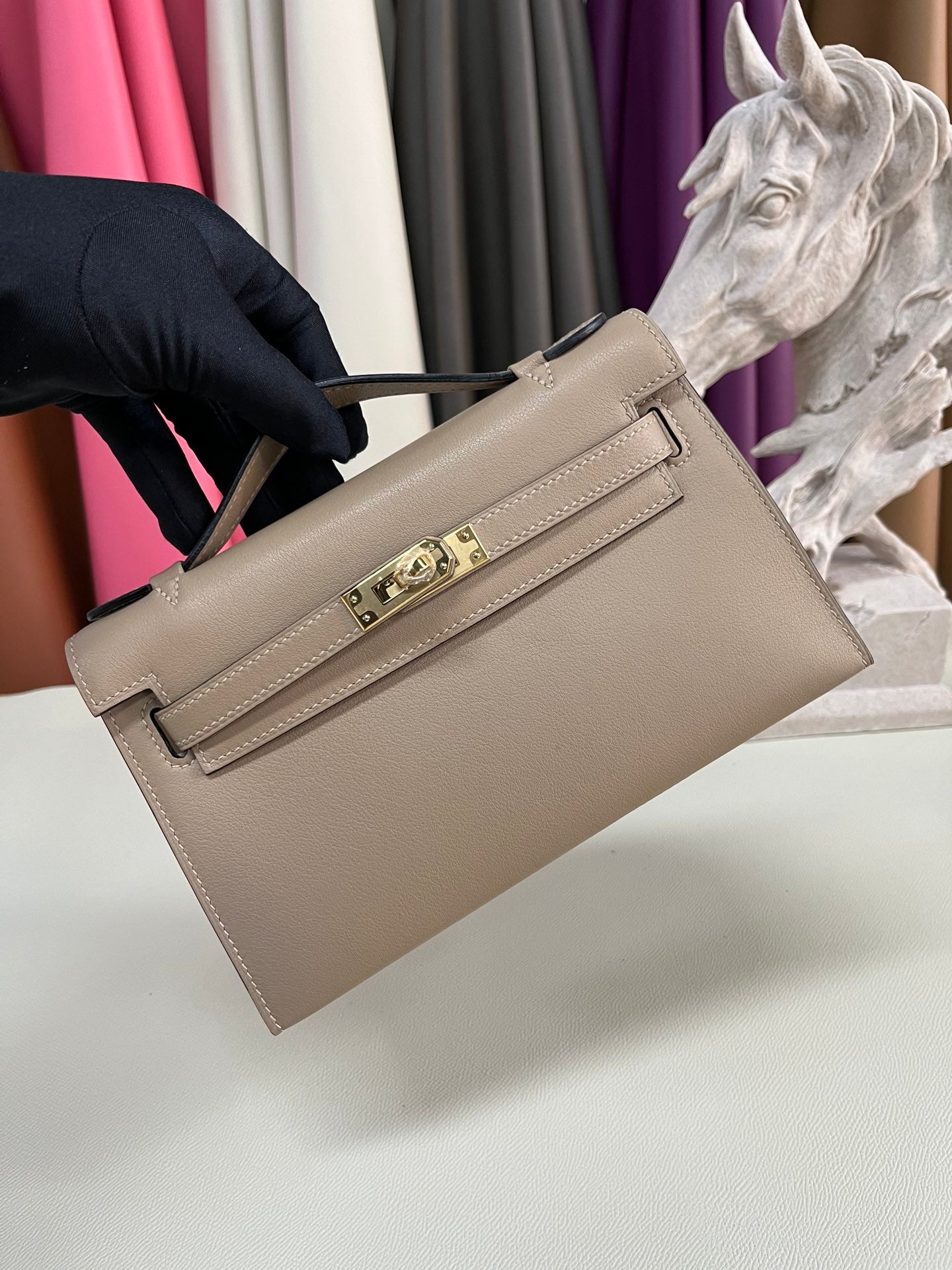 Elegant Pochette Handbag in Smooth Gold Finish