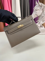 Elegant Pochette Handbag in Smooth Gold Finish