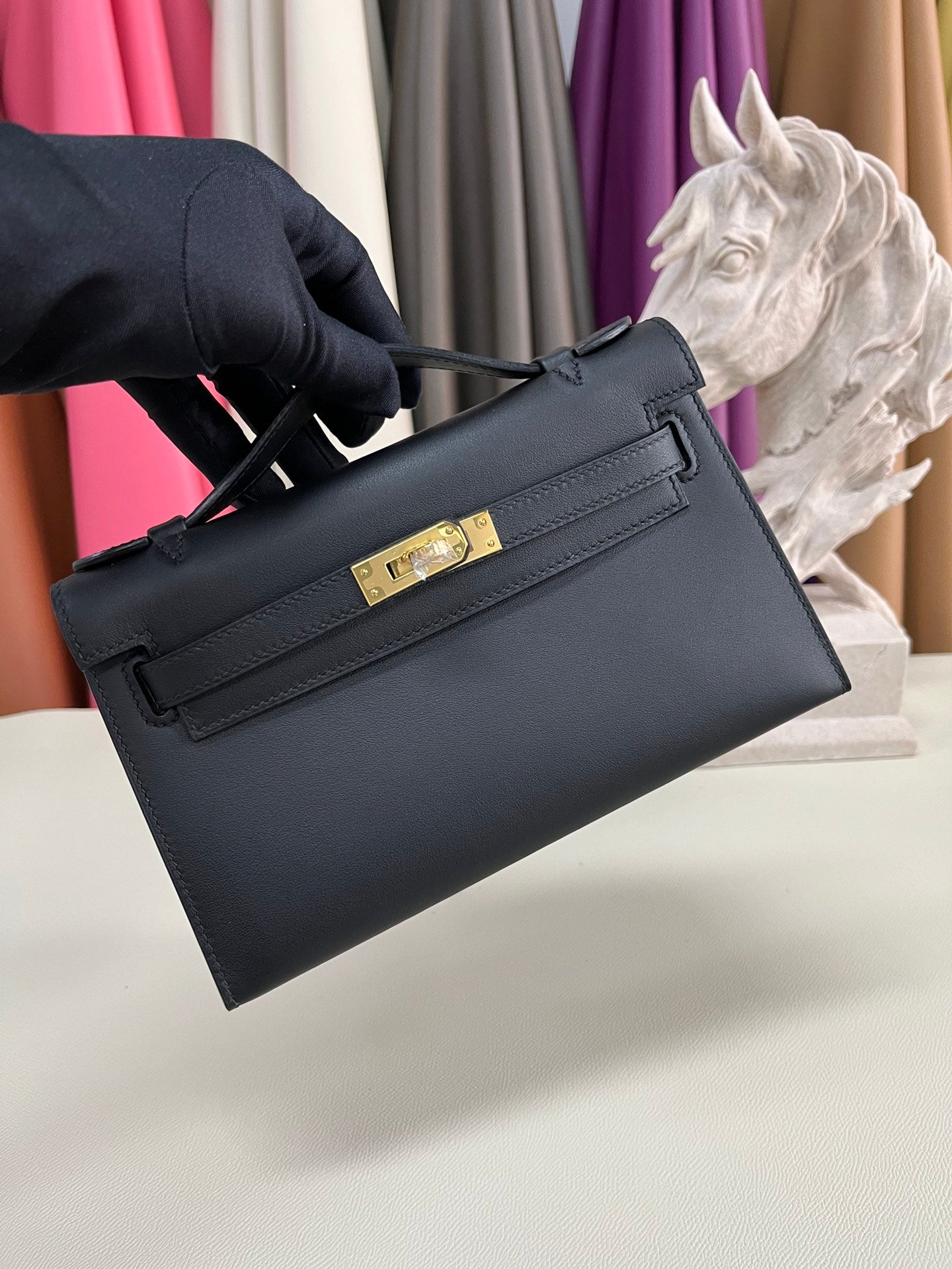 Elegant Pochette Handbag in Smooth Gold Finish