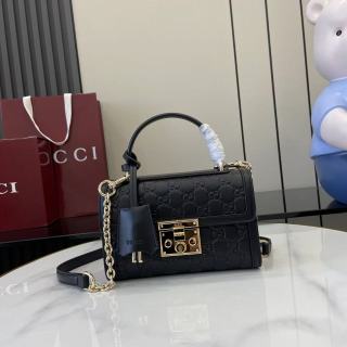 Structured Small Top Handle Bag with Padlock Closure