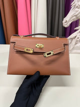 Elegant Pochette Handbag in Smooth Gold Finish