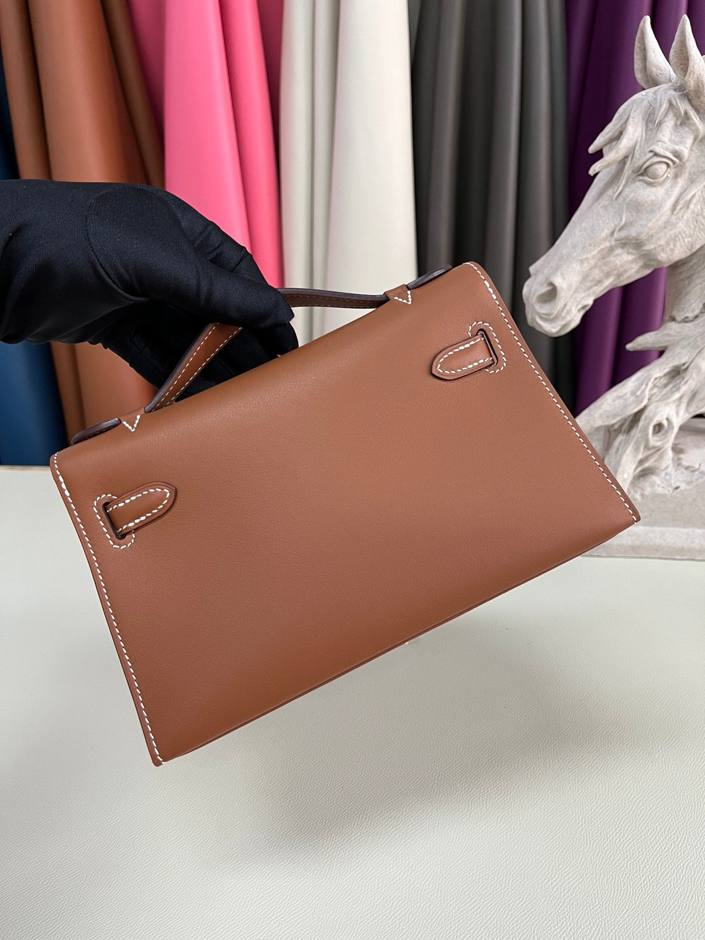 Elegant Pochette Handbag in Smooth Gold Finish