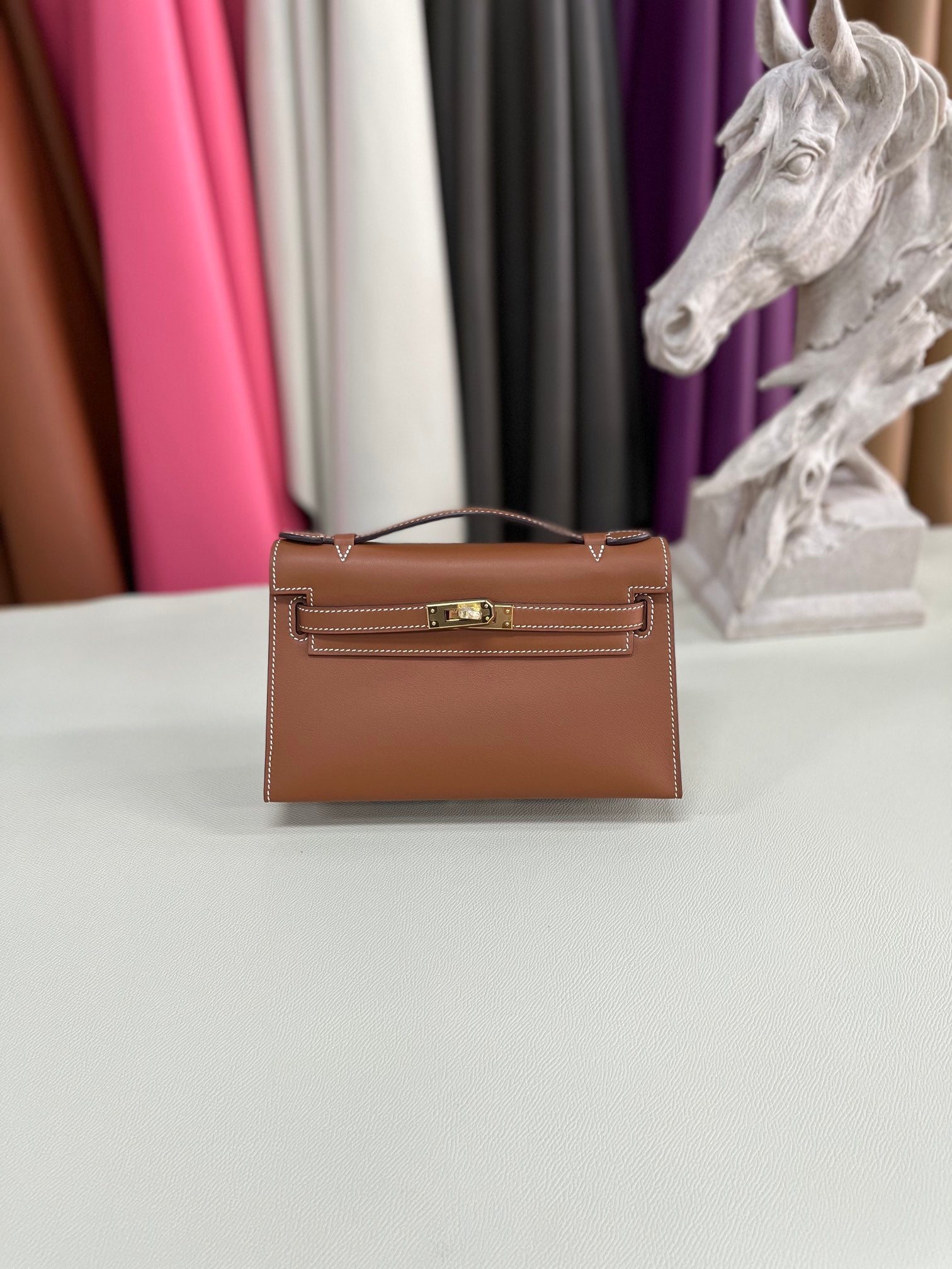 Elegant Pochette Handbag in Smooth Gold Finish