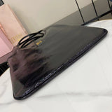 High-Gloss Patent Leather Tote with Metallic Accents