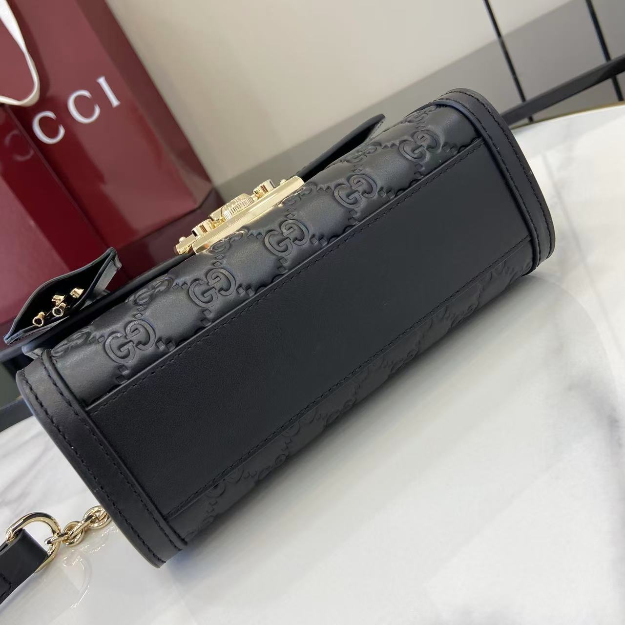 Structured Small Top Handle Bag with Padlock Closure