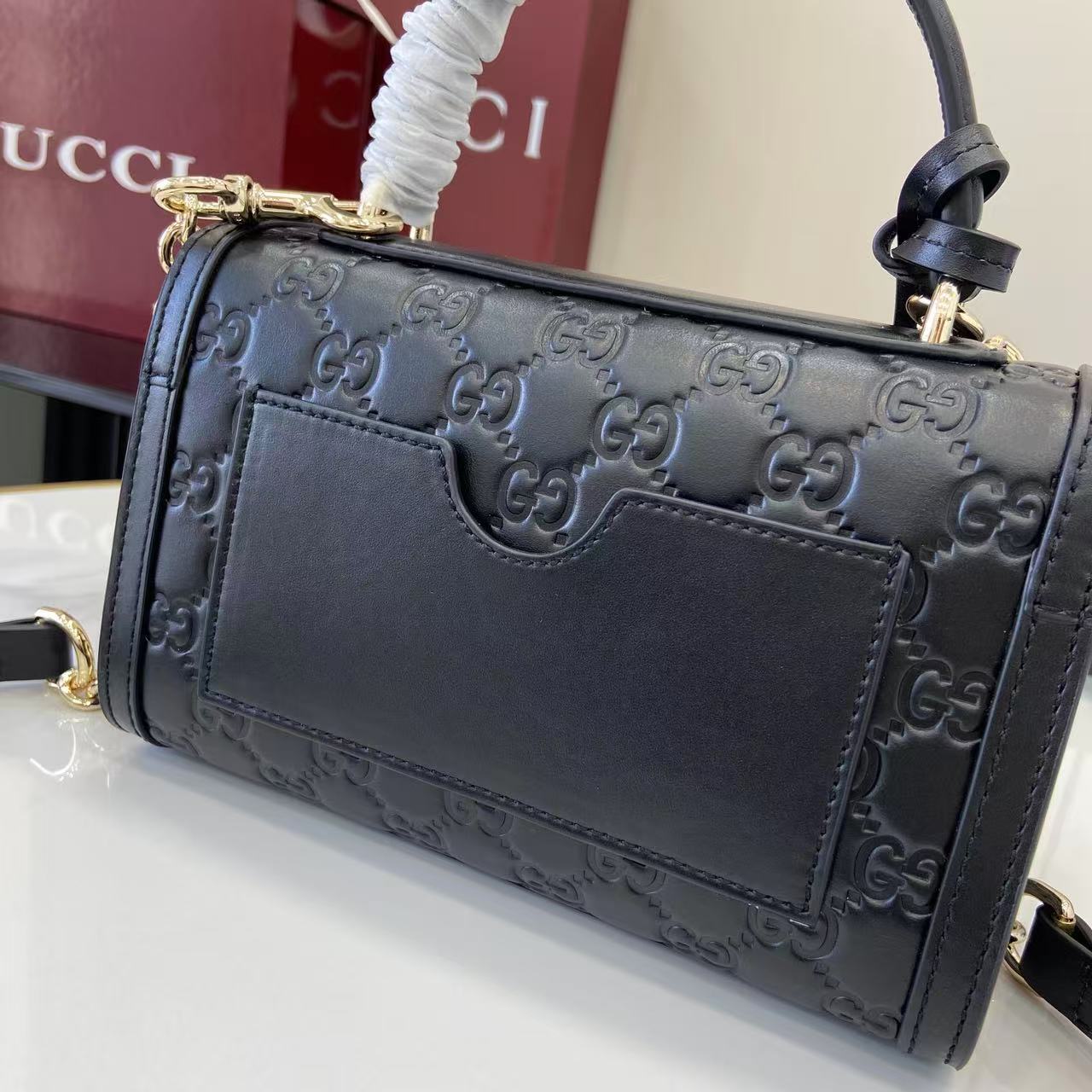 Structured Small Top Handle Bag with Padlock Closure