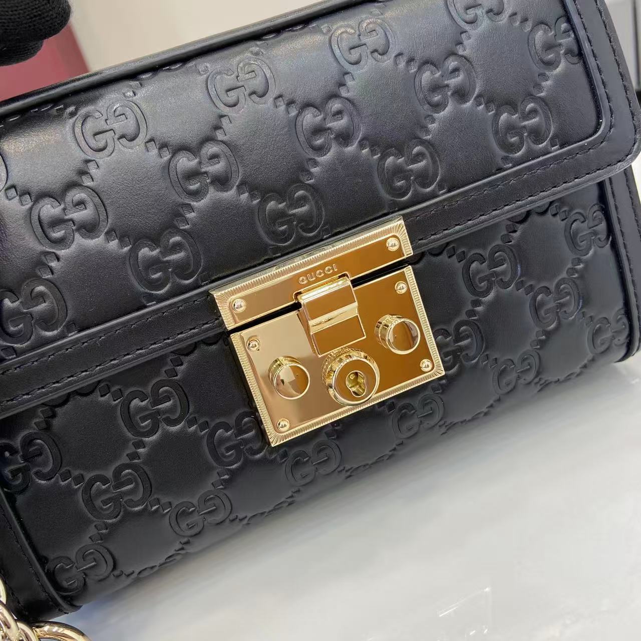 Structured Small Top Handle Bag with Padlock Closure