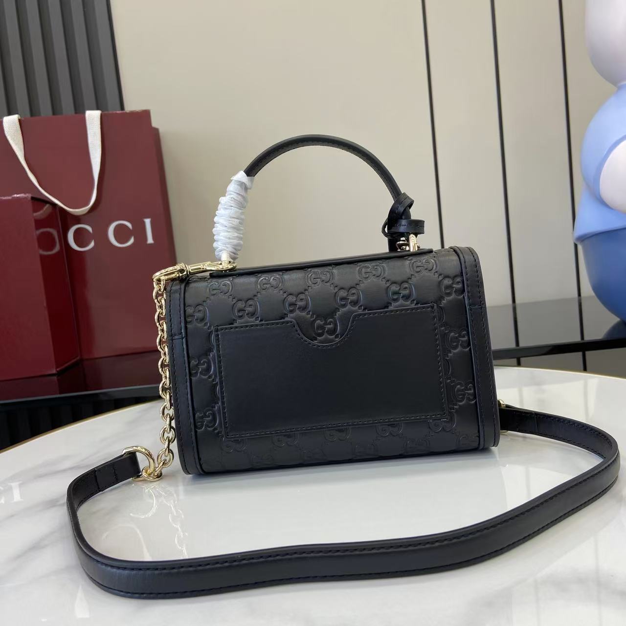 Structured Small Top Handle Bag with Padlock Closure