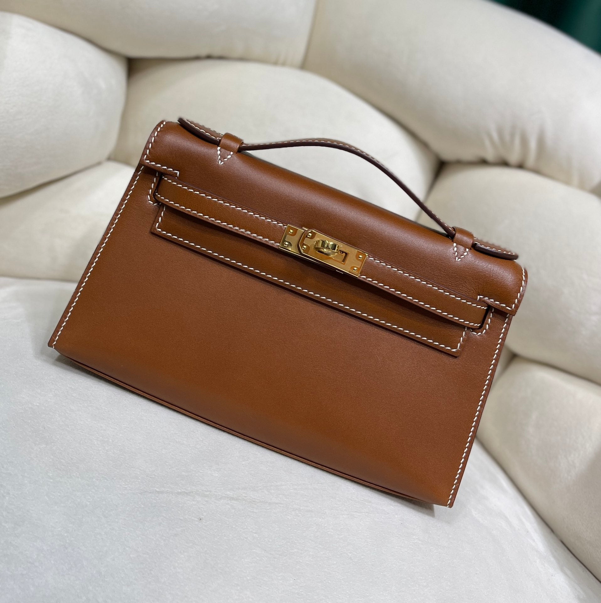 Gold Swift Pochette Handbag with Elegant Gold Hardware