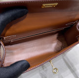 Gold Swift Pochette Handbag with Elegant Gold Hardware